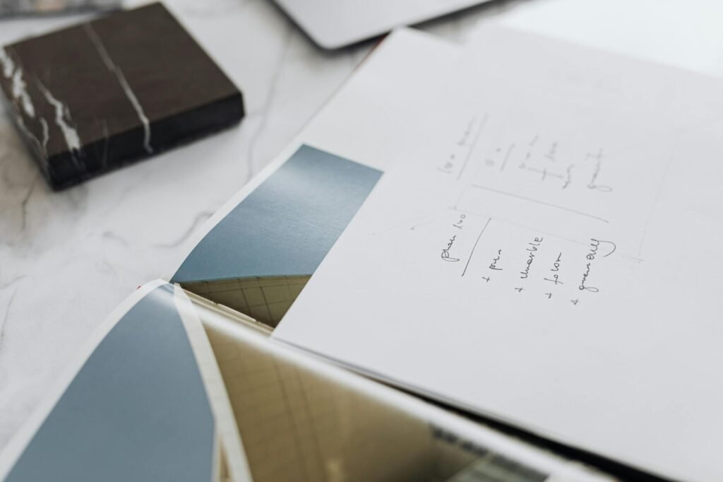 electrical certification documents and inspection on a desk with blueprint and panel background