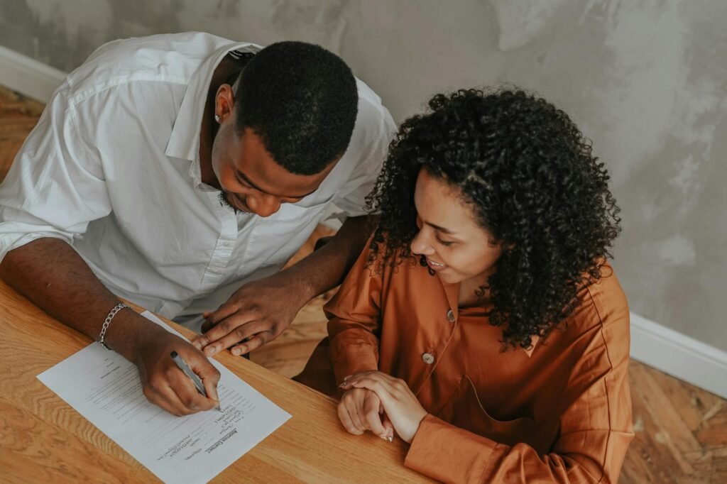electrician reviewing wiring diagrams and certification documents on a desk