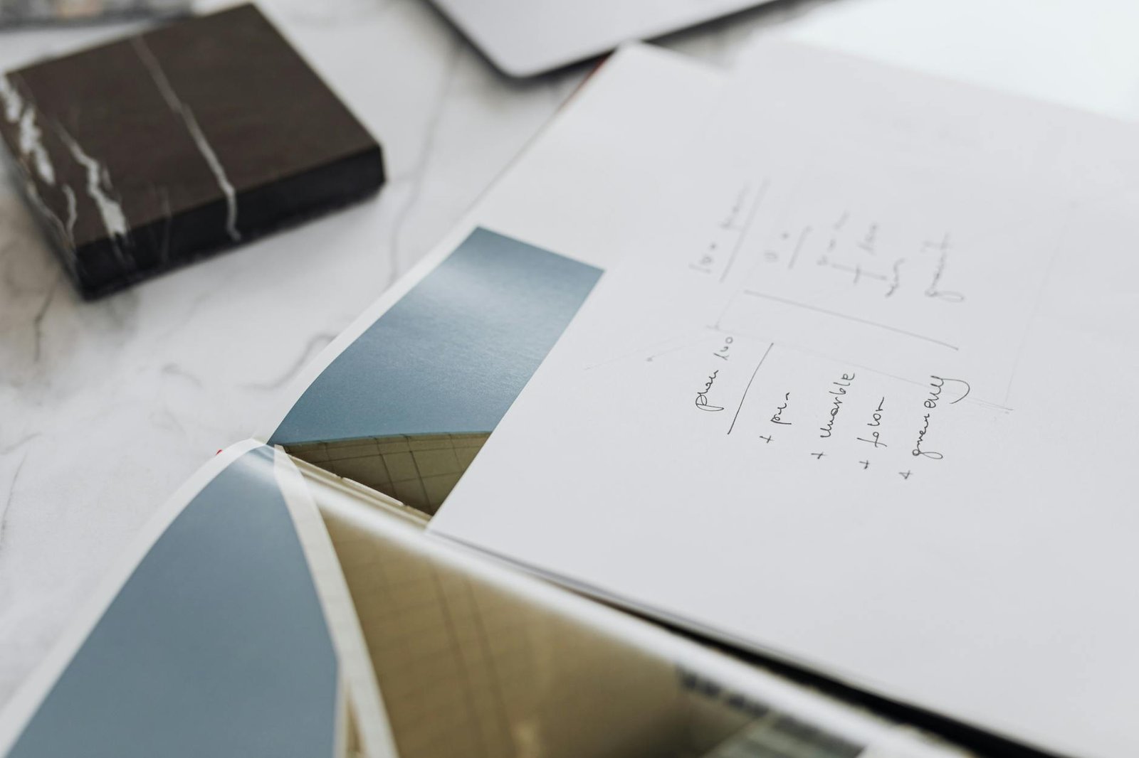 "electricity certification documents on desk with blueprint background"