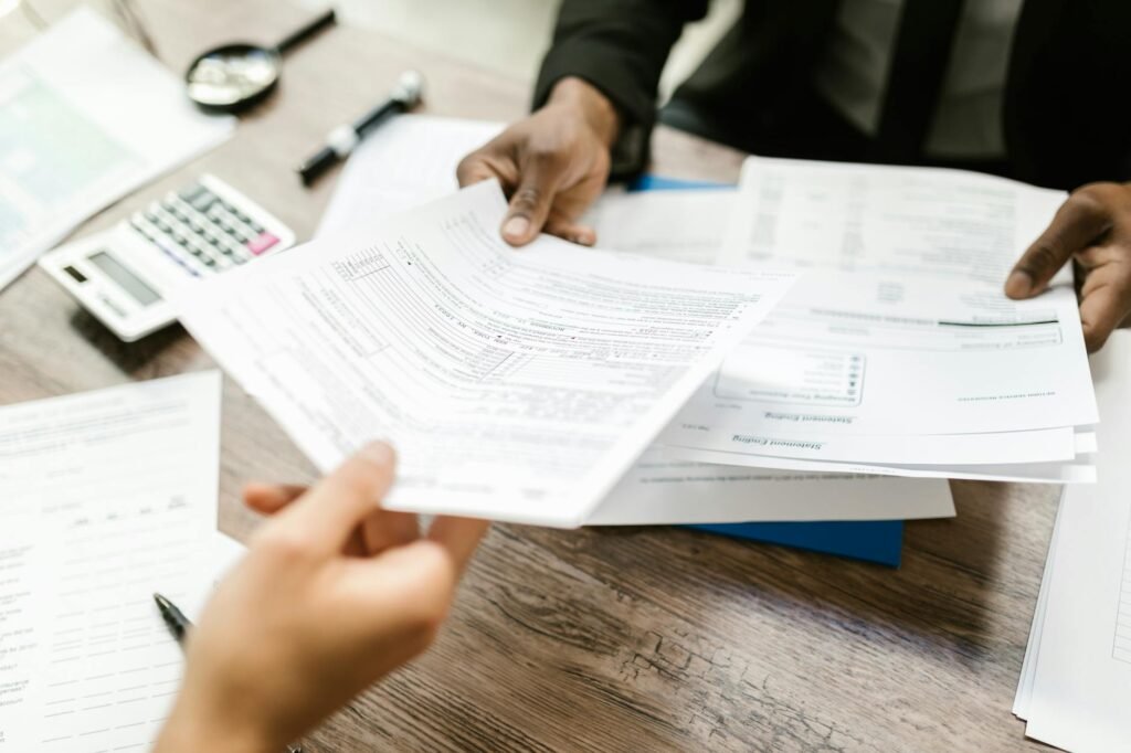 electrician reviewing electrical certification documents on a desk
